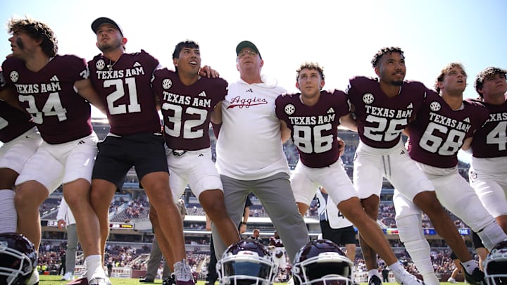 Texas A&M Aggies head coach Mike Elko celebrates a 52-10 win against the McNeese State Cowboys. Texas A&M Aggies head coach Mike Elko celebrates a 52-10 win against the McNeese State Cowboys.