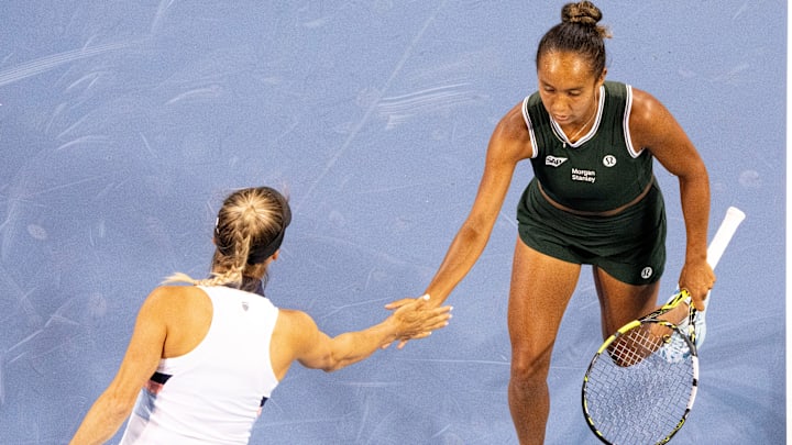 Yulia Putintseva, of Kazakhstan, and Leylah Fernandez, of Canada, high five after winning a point against Asia Muhammad, of the United States, and Erin Routliffe, of New Zealand, against during the Women’s Double’s final at the Cincinnati Open.