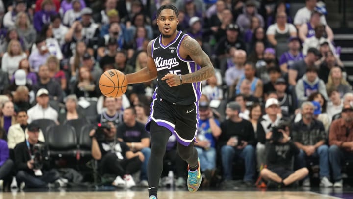 Mar 31, 2024; Sacramento, California, USA; Sacramento Kings guard Davion Mitchell (15) dribbles against the Utah Jazz 