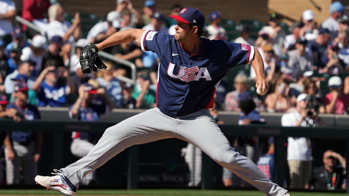 Mar 4, 2026; Scottsdale, AZ, USA; United States pitcher Clayton Kershaw (22) throws against the Colorado Rockies in the third inning at Salt River Fields. Mandatory Credit: Rick Scuteri-Imagn Images