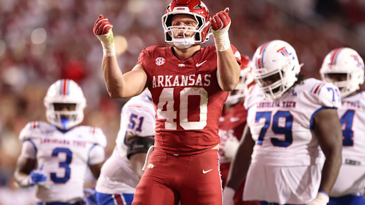 Nov 23, 2024; Fayetteville, Arkansas, USA; Arkansas Razorbacks defensive lineman Landon Jackson (40) celebrates after sacking Louisiana Tech Bulldogs quarterback Evan Bullock (7) during the fourth quarter at Donald W. Reynolds Razorback Stadium. Arkansas won 35-14. Mandatory Credit: Nelson Chenault-Imagn Images