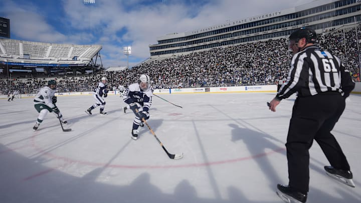 Penn State Nittany Lions forward Dane Dowiak (19) skates with the puck during the first period against the Michigan State Spartans at Beaver Stadium. Penn State Nittany Lions forward Dane Dowiak (19) skates with the puck during the first period against the Michigan State Spartans at Beaver Stadium.