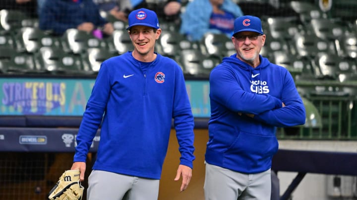 May 29, 2024; Milwaukee, Wisconsin, USA;  Chicago Cubs manager Craig Counsell (left) talks to bullpen coach Darren Holmes before game against the Milwaukee Brewers at American Family Field. 