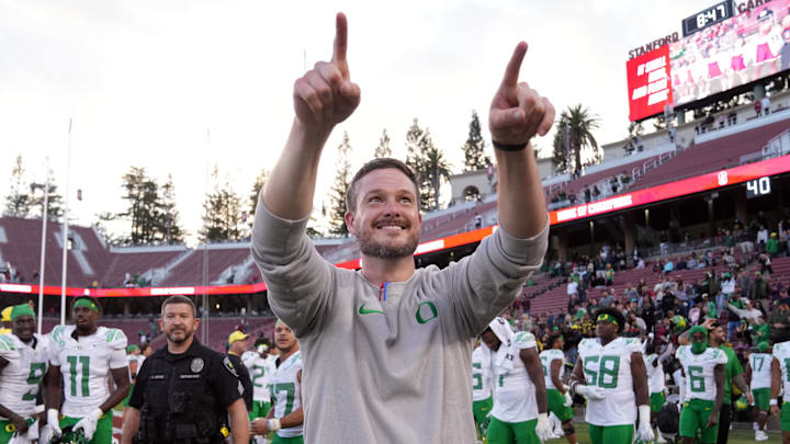 Sep 30, 2023; Stanford, California, USA; Oregon Ducks head coach Dan Lanning celebrates after defeating the Stanford Cardinal at Stanford Stadium. Mandatory Credit: Darren Yamashita-Imagn Images Sep 30, 2023; Stanford, California, USA; Oregon Ducks head coach Dan Lanning celebrates after defeating the Stanford Cardinal at Stanford Stadium. Mandatory Credit: Darren Yamashita-Imagn Images