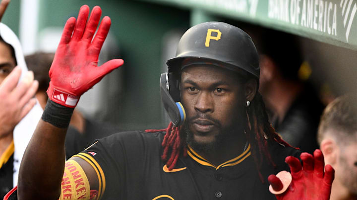 Aug 30, 2025; Boston, Massachusetts, USA; Pittsburgh Pirates center fielder Oneil Cruz (15) high-fives his teammates after hitting a solo home run against the Boston Red Sox during the fifth inning at Fenway Park. Mandatory Credit: Brian Fluharty-Imagn Images