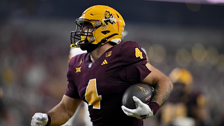 Dec 7, 2024; Arlington, TX, USA; Arizona State Sun Devils running back Cam Skattebo (4) scores a rushing touchdown against the Iowa State Cyclones during the second half at AT&T Stadium. Mandatory Credit: Jerome Miron-Imagn Images