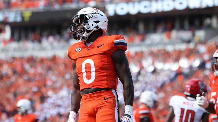 Aug 29, 2026; Charlottesville, Virginia, USA;  Virginia Cavaliers running back Xavier Brown (0) celebrates a touchdown during the second quarter against North Carolina State Wolfpack at Scott Stadium.  Mandatory Credit: Greg Atkins-Imagn Images