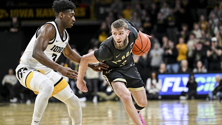 Purdue Boilermakers guard Braden Smith (3) is defended by Iowa Hawkeyes guard Drew Thelwell (3) 