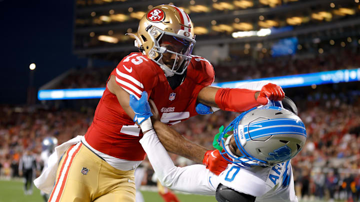 Dec 30, 2024; Santa Clara, California, USA; San Francisco 49ers wide receiver Jauan Jennings (15) and Detroit Lions cornerback Terrion Arnold (0) get tangled after a play during the first quarter at Levi's Stadium. Mandatory Credit: Sergio Estrada-Imagn Images