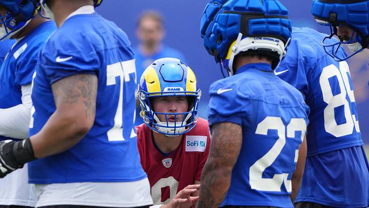 May 28, 2025; Woodland Hills, CA, USA; Los Angeles Rams quarterback Matt Stafford (9) gives the play to running back Karen Williams (23) in the huddle during organized team activities at Rams Practice Facility. Mandatory Credit: Kirby Lee-Imagn Images