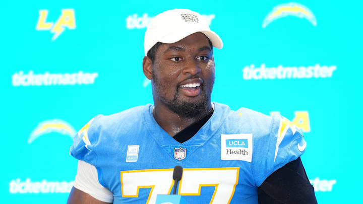 Jul 25, 2025; El Segundo, CA, USA; Los Angeles Chargers guard Zion Johnson (77) during training camp press conference at The Bolt. Mandatory Credit: Kirby Lee-Imagn Images
