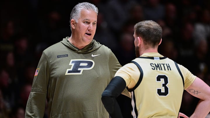 Purdue Boilermakers head coach Matt Painter talks with guard Braden Smith
