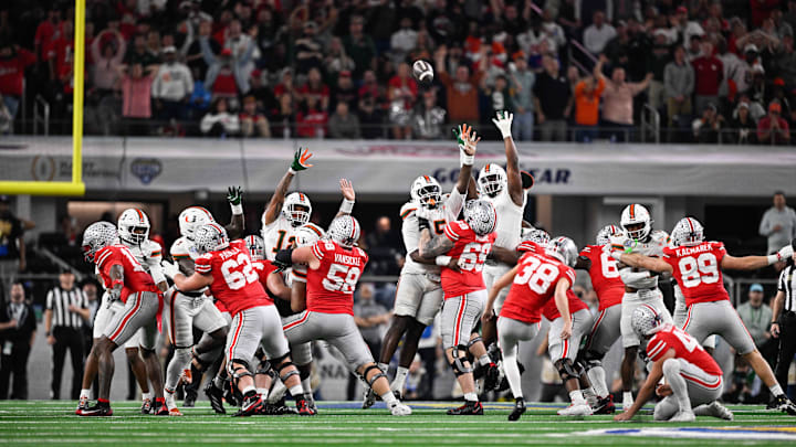 Dec 31, 2025; Arlington, TX, USA; Ohio State Buckeyes kicker Jayden Fielding (38) attempts a field goal in the second quarter against the Miami Hurricanes during the 2025 Cotton Bowl and quarterfinal game of the College Football Playoff at AT&T Stadium. Mandatory Credit: Jerome Miron-Imagn Images