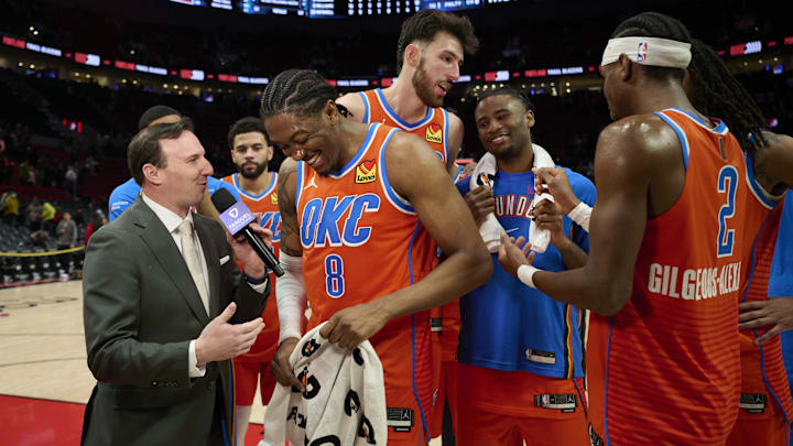 Nov 30, 2025; Portland, Oregon, USA; Oklahoma City Thunder guard Jalen Williams (8) laughs during a post-game interview with teammates after a game against the Portland Trail Blazers at Moda Center.