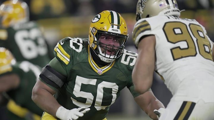 Green Bay Packers right tackle Zach Tom (50) blocks New Orleans Saints defensive end Payton Turner.