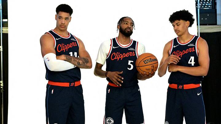 Clippers players Konan Niederhauser, Derrick Jones Jr. and Kobe Sanders pose for a picture at media day. Clippers players Konan Niederhauser, Derrick Jones Jr. and Kobe Sanders pose for a picture at media day.
