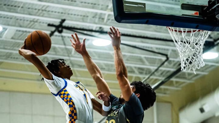 Mainland senior guard Beegie Gordon (left) put on a show against Oak Ridge, scoring 15 points, including three 3-pointers, and hauling down five rebounds to lead the Buccaneers to a 57-53 victory. Mainland senior guard Beegie Gordon (left) put on a show against Oak Ridge, scoring 15 points, including three 3-pointers, and hauling down five rebounds to lead the Buccaneers to a 57-53 victory.