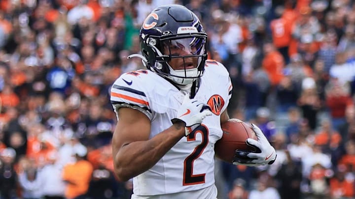 Chicago Bears wide receiver DJ Moore (2) runs with the ball against the Cincinnati Bengals during the fourth quarter at Paycor Stadium. Chicago Bears wide receiver DJ Moore (2) runs with the ball against the Cincinnati Bengals during the fourth quarter at Paycor Stadium.