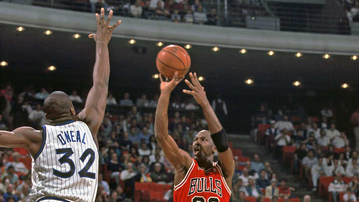 Chicago Bulls guard (23) Michael Jordan shoots over Orlando Magic center (32) Shaquille O' Neal at the Orlando Arena. Chicago Bulls guard (23) Michael Jordan shoots over Orlando Magic center (32) Shaquille O' Neal at the Orlando Arena.