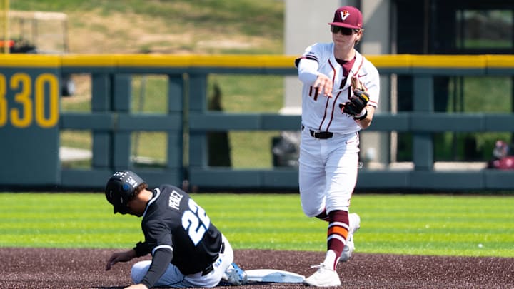 Ethan Ball throws to first looking to turn a double play against Duke in 2026.
