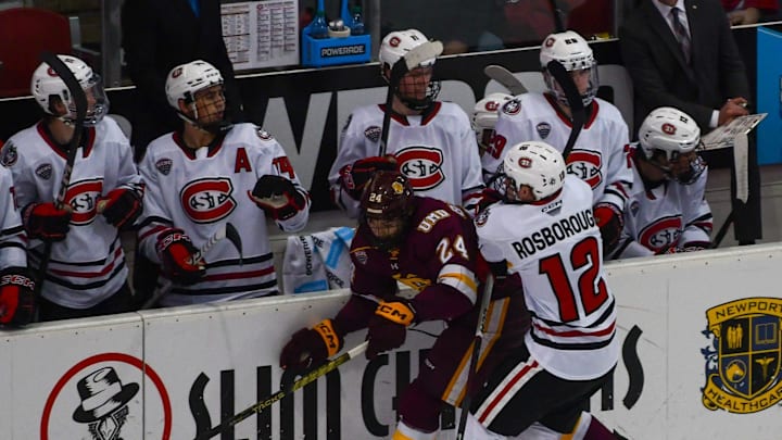 St. Cloud State hockey sophomore Ryan Rosborough hits Duluth forward Kyle Bettens on Nov. 18 in the second game of a series sweep against the Bulldogs in the Herb Brooks National Hockey Center.