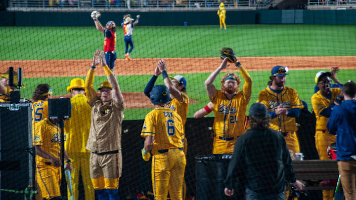 Bringing the spirit: Players from the Savannah Bananas celebrate a key play during their 5-3 victory in Tallahassee. The historic three-day opening weekend at Doak Campbell Stadium officially launched the team's nationwide 50-game regular season.