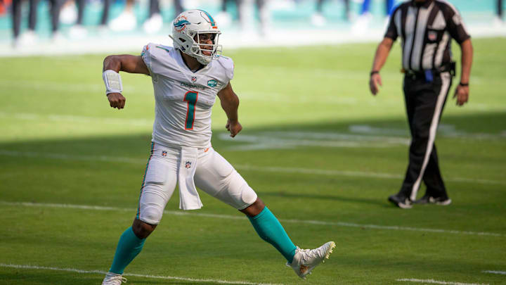 Miami Dolphins quarterback Tua Tagovailoa (1) celebrates his first touchdown pass to Miami Dolphins wide receiver DeVante Parker (11) at Hard Rock Stadium in Miami Gardens, November 1, 2020.