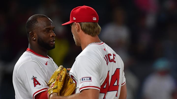 Angels third baseman Miguel Sano (22) pitcher Ben Joyce (44) designated hitter Willie Calhoun (5) and catcher Logan O'Hoppe (14) celebrate the victory against the Detroit Tigers at Angel Stadium.