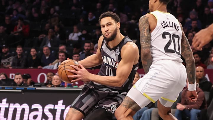 Dec 21, 2024; Brooklyn, New York, USA;  Brooklyn Nets guard Ben Simmons (10) dribbles the ball against Utah Jazz forward John Collins (20) in the first quarter at Barclays Center. Mandatory Credit: Wendell Cruz-Imagn Images