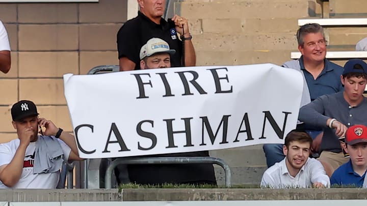 Aug 2, 2023; Bronx, New York, USA; A fan holds up a sign referring to New York Yankees general manager Brian Cashman during the first inning between the New York Yankees and the Tampa Bay Rays at Yankee Stadium. Mandatory Credit: Brad Penner-Imagn Images