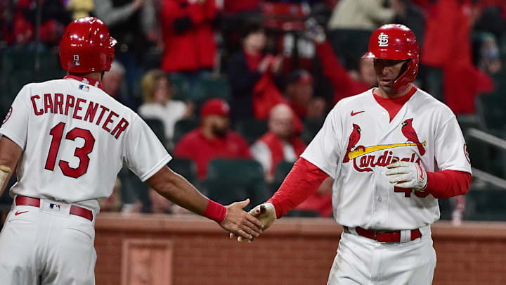 Apr 13, 2021; St. Louis, Missouri, USA;  St. Louis Cardinals first baseman Paul Goldschmidt (46) is congratulated by second baseman Matt Carpenter (13) after scoring during the fifth inning against the Washington Nationals at Busch Stadium. Mandatory Credit: Jeff Curry-Imagn Images
