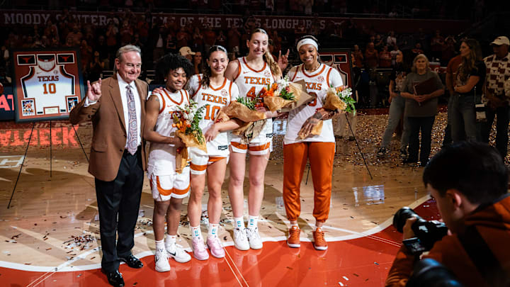 Texas Longhorns head coach Vic Schaefer stands with the four seniors on his team, Rori Harmon, Shay Holle, Taylor Jones and Aaliyah Moore during senior day honors following the Longhorns' win over the Florida Gators, March 2, 2025. With the 72-46 win over the Gators, the Texas Longhorns become regular season SEC Champions.