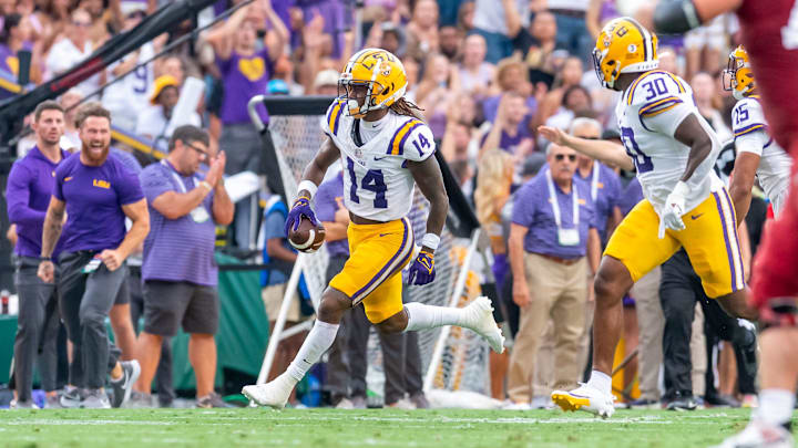 Tigers safety Andre Sam 14 makes an interception as the LSU Tigers take on the Arkansas Razorbacks at Tiger Stadium in Baton Rouge, Louisiana, Sept. 23, 2023. Tigers safety Andre Sam 14 makes an interception as the LSU Tigers take on the Arkansas Razorbacks at Tiger Stadium in Baton Rouge, Louisiana, Sept. 23, 2023.