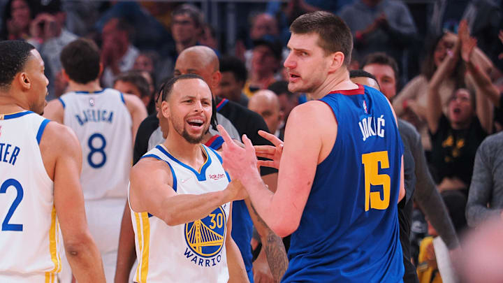 Apr 18, 2022; San Francisco, California, USA; Golden State Warriors guard Stephen Curry (30) and Denver Nuggets center Nikola Jokic (15) in a confrontation as a time out is called during the first quarter of game two of the first round for the 2022 NBA playoffs at Chase Center. Mandatory Credit: Kelley L Cox-Imagn Images Apr 18, 2022; San Francisco, California, USA; Golden State Warriors guard Stephen Curry (30) and Denver Nuggets center Nikola Jokic (15) in a confrontation as a time out is called during the first quarter of game two of the first round for the 2022 NBA playoffs at Chase Center. Mandatory Credit: Kelley L Cox-Imagn Images