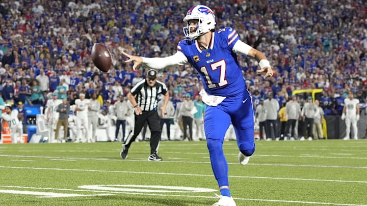 Sep 18, 2025; Orchard Park, New York, USA; Buffalo Bills quarterback Josh Allen (17) makes a pass for a touchdown against the Miami Dolphins