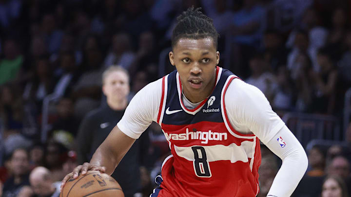 Apr 13, 2025; Miami, Florida, USA;  Washington Wizards guard Bub Carrington (8) drives the ball against the Miami Heat during the second half at Kaseya Center. Mandatory Credit: Rhona Wise-Imagn Images