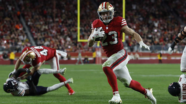 Dec 28, 2025; Santa Clara, California, USA; San Francisco 49ers running back Christian McCaffrey (23) runs for a touchdown against the Chicago Bears in the first half at Levi's Stadium. Mandatory Credit: Sergio Estrada-Imagn Images