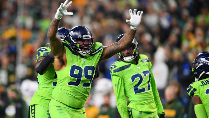 Dec 15, 2024; Seattle, Washington, USA; Seattle Seahawks defensive end Leonard Williams (99) celebrates after a defensive play against the Green Bay Packers during the second half at Lumen Field. 