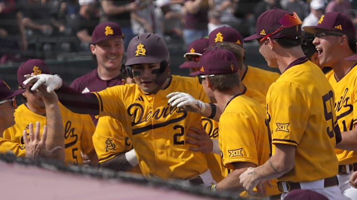 Arizona State catcher Josiah Cromwick (21) is congratulated after a solo home run against Ohio State during the first inning at Phoenix Municipal Stadium on Feb. 16, 2025.
