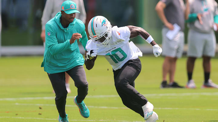 Miami Dolphins wide receiver Tyreek Hill (10) practices during mandatory minicamp at Hard Rock Stadium. 