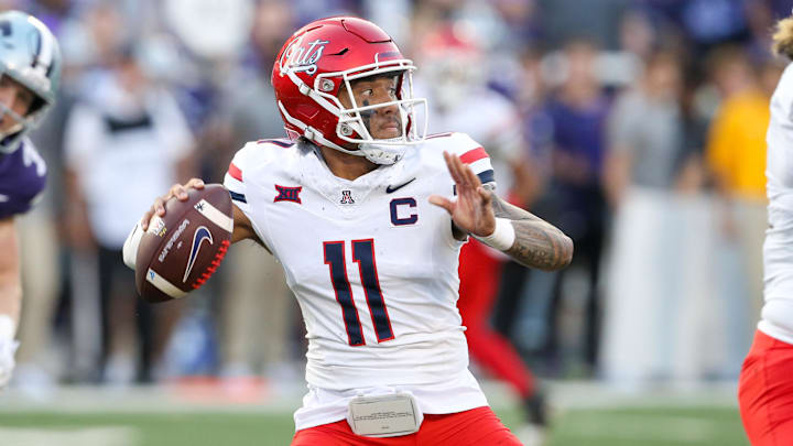 Sep 13, 2024; Manhattan, Kansas, USA; Arizona Wildcats quarterback Noah Fifita (11) drops back to pass during the first quarter against the Kansas State Wildcats at Bill Snyder Family Football Stadium. 