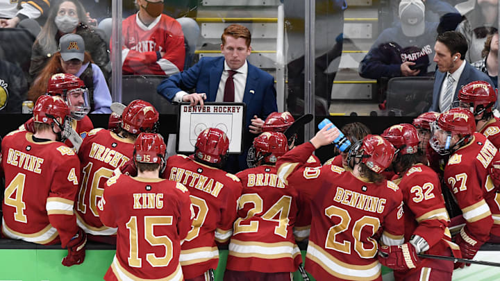 Denver Pioneers head coach David Carle talks with his team during the 2022 Frozen Four college national championship game. Denver Pioneers head coach David Carle talks with his team during the 2022 Frozen Four college national championship game.