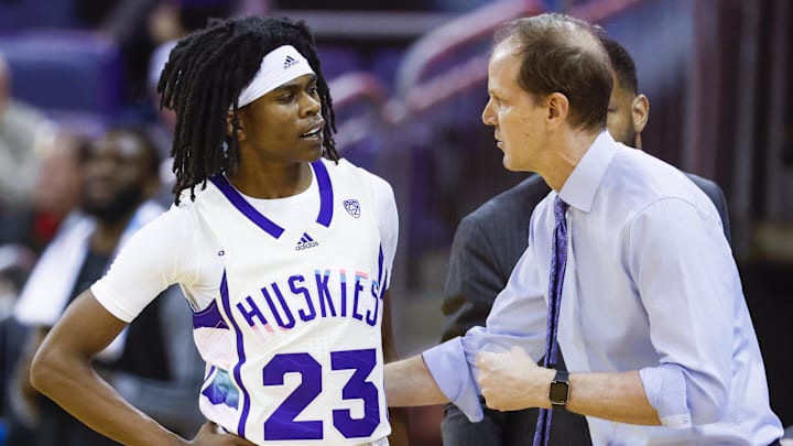 Then Washington coach Mike Hopkins talks with guard Keyon Menifield (23) during a 2023 game. Then Washington coach Mike Hopkins talks with guard Keyon Menifield (23) during a 2023 game.