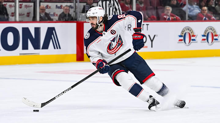 Nov 16, 2024; Montreal, Quebec, CAN; Columbus Blue Jackets right wing Kirill Marchenko (86) plays the puck against the Montreal Canadiens during the first period at Bell Centre. Mandatory Credit: David Kirouac-Imagn Images