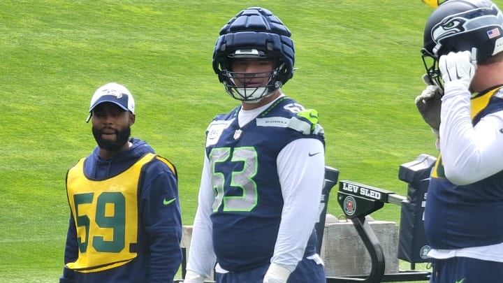 Seahawks rookie guard Sataoa Laumea plays defense on the scout team during a positional drill at OTAs.