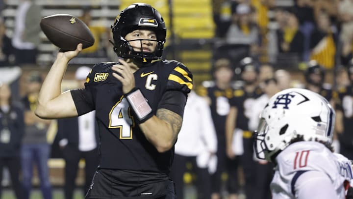 Sep 19, 2024; Boone, North Carolina, USA;  Appalachian State Mountaineers quarterback Joey Aguilar (4) throws a pass over South Alabama Jaguars linebacker Aakil Washington (10) during the second half at Kidd Brewer Stadium. Mandatory Credit: Reinhold Matay-Imagn Images