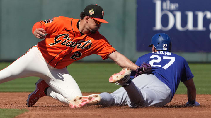 Los Angeles Dodgers center fielder Michael Siani steals second base under the tag by San Francisco Giants shortstop Willy Adames.