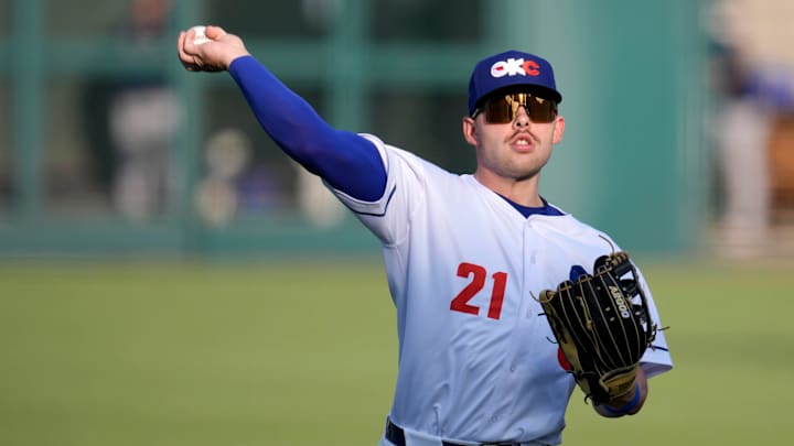 Oklahoma City's Dalton Rushing (21) warms up before a baseball game between the Oklahoma City Baseball Club and the Round Rock Express at the Chickasaw Bricktown Ballpark in Oklahoma City, Wednesday, Aug. 7, 2024.