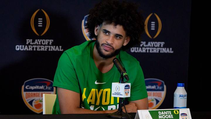 Dec. 30, 2025; Miami, Florida; Oregon quarterback Dante Moore speaks during the Orange Bowl media day at Hard Rock Stadium in Miami, Florida. Dec. 30, 2025; Miami, Florida; Oregon quarterback Dante Moore speaks during the Orange Bowl media day at Hard Rock Stadium in Miami, Florida.
