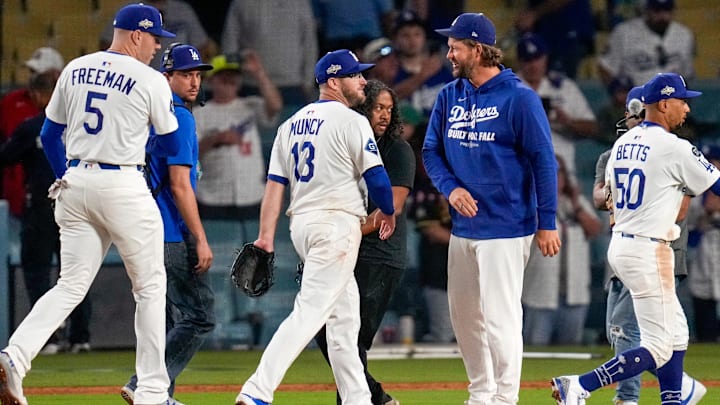 Newly retired Los Angeles Dodgers pitcher Clayton Kershaw celebrates the win after the ninth inning of the MLB National League Wild Card Game 1 between the Los Angeles Dodgers and the Cincinnati Reds at Dodger Stadium in Los Angeles on Tuesday, Sept. 30, 2025. The Dodgers won game 1 of the series, 10-5.